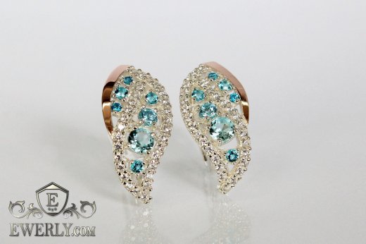 Жіночі сережки зі срібла з золотом і світло-блакитним камінням купити
